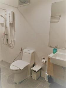 a bathroom with a toilet and a sink at Live like a local in Ekkamai in Bangkok