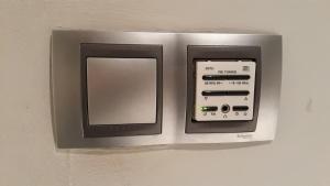 a wall mounted microwave with a control panel at Apartamento Manuela Sancho in Zaragoza