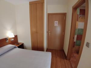 Postel nebo postele na pokoji v ubytování Hostal Prada Borges