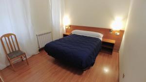 Postel nebo postele na pokoji v ubytování Hostal Prada Borges