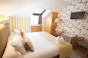 Cama o camas de una habitación en Hotel La Casona de Llerices