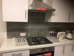 a kitchen with a stove top oven in a kitchen at 96 Rochester Street in Chatham