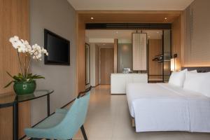 Lova arba lovos apgyvendinimo įstaigoje Hotel Santika Premiere Bandara Palembang