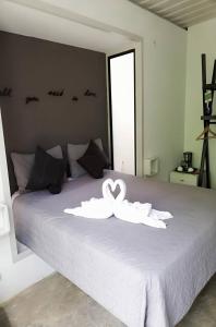 Postel nebo postele na pokoji v ubytování Green Sanctuary Hotel