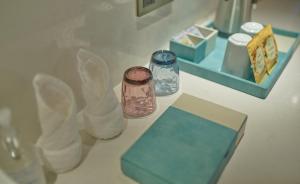 a counter top with two jars and a mirror at CityNote Hotel Shangxiajiu Pedestrian Guangzhou in Guangzhou +46 photos