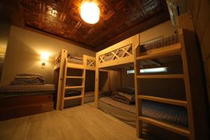 a bunk bed room with two bunk beds in it at Stitches House in Seoul