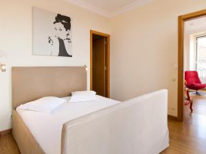 En eller flere senge i et værelse på City Stays Chiado Apartments
