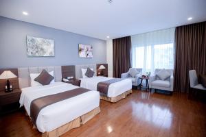 Giường trong phòng chung tại Muong Thanh Sapa Hotel
