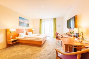 Postel nebo postele na pokoji v ubytování Hotel Königslinie