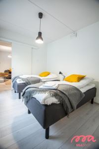 Llit o llits en una habitació de Spot Apartments Espoo Center
