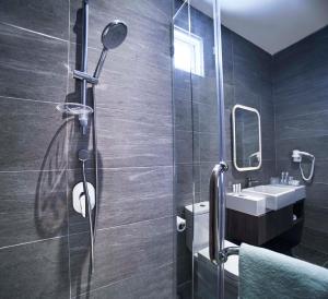 Koupelna v ubytování Urban H Hotel