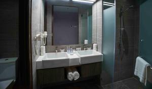 Koupelna v ubytování Urban H Hotel