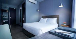Postel nebo postele na pokoji v ubytování Urban H Hotel