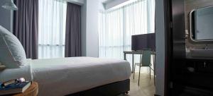TV a/nebo společenská místnost v ubytování Urban H Hotel