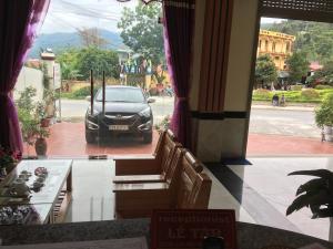 a car parked in front of a building at Kien Thao Hotel in Ha Giang