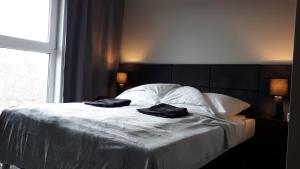 Postel nebo postele na pokoji v ubytování Apartament Stara Gazownia