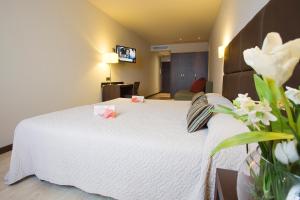 Postel nebo postele na pokoji v ubytování Hotel Torre de Núñez