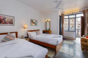 Un pat sau paturi într-o cameră la Pacific Guest House