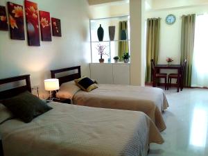 A bed or beds in a room at MS Residence Building