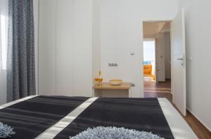 Postel nebo postele na pokoji v ubytování Villa Kata Razanj