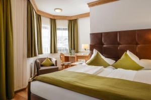 Postel nebo postele na pokoji v ubytování Hotel Haymon