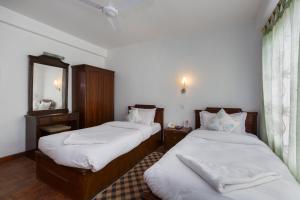 Letto o letti in una camera di Pacific Guest House