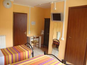 Letto o letti in una camera di Albergo Gino