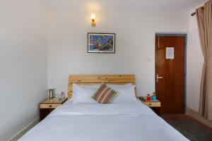 Letto o letti in una camera di Pacific Guest House
