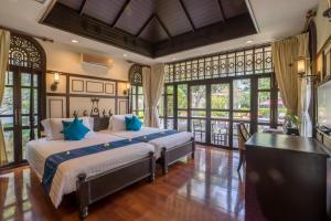 Postel nebo postele na pokoji v ubytování Wora Bura Hua Hin Resort & Spa
