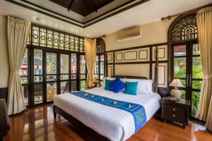 Postel nebo postele na pokoji v ubytování Wora Bura Hua Hin Resort & Spa