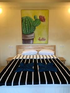 Rúm í herbergi á Lazy Inn Kuta Lombok