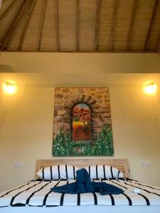 Rúm í herbergi á Lazy Inn Kuta Lombok