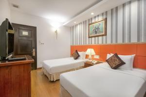Voodi või voodid majutusasutuse Sun River Hotel toas