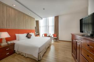 Voodi või voodid majutusasutuse Sun River Hotel toas