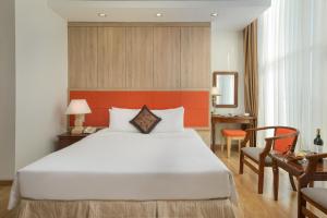 Voodi või voodid majutusasutuse Sun River Hotel toas