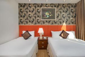 Voodi või voodid majutusasutuse Sun River Hotel toas