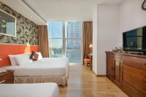 Voodi või voodid majutusasutuse Sun River Hotel toas