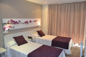 Postel nebo postele na pokoji v ubytování Hotel Brisa Marina
