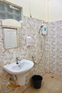 a bathroom with a sink and a shower at IRIS MOTEL in Tachilek +17 photos