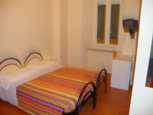 Letto o letti in una camera di Albergo Gino