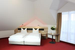 Postel nebo postele na pokoji v ubytování Hotel 3 Linden
