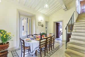 a dining room with a table and chairs at La Canonica di Alica in Palaia