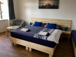 Postel nebo postele na pokoji v ubytování Apartmany a Ubytovani Mlynice Litovel
