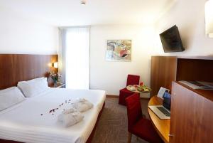 TV a/nebo společenská místnost v ubytování Vicenza Tiepolo Hotel