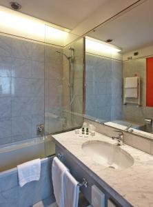 a bathroom with a sink and a shower at Vicenza Tiepolo Hotel in Vicenza