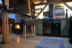 a kitchen with a stove and a oven with a stove at Normandia in Kuźnica
