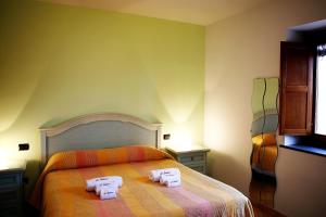 A bed or beds in a room at Il Raduno