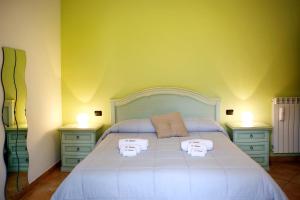 A bed or beds in a room at Il Raduno