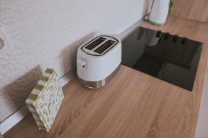 a scale model of a kitchen with a toaster on the floor at Poolside Hideout Apartments in Novalja