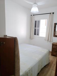 Ένα ή περισσότερα κρεβάτια σε δωμάτιο στο Casa Florianópolis: Praia - Sul da Ilha